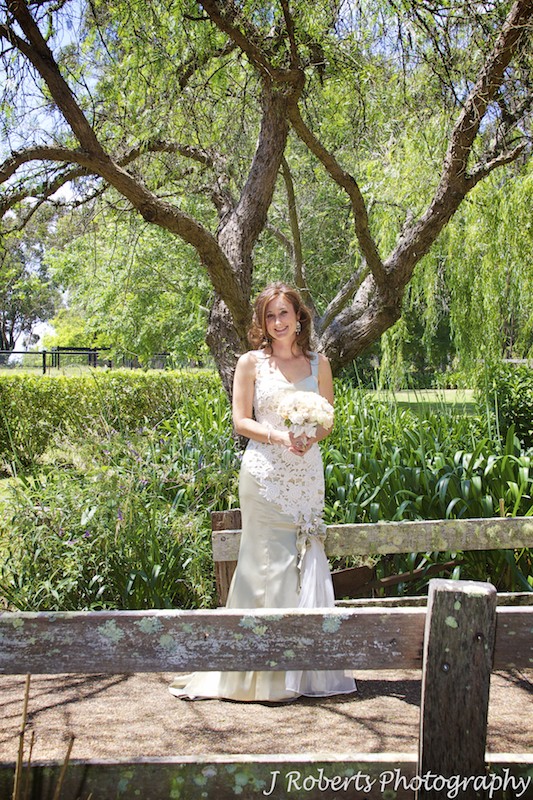 Bride on rustic bridge - wedding photography sydney